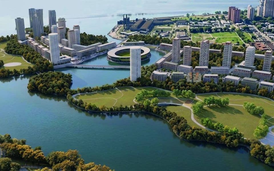 Vista aérea del masterplan con la bahía central y el parque