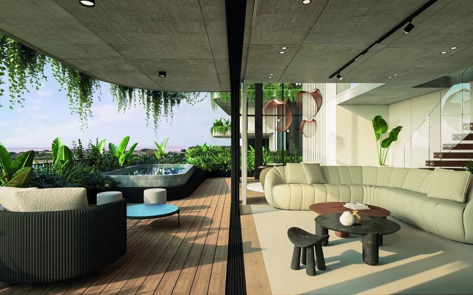 Living integrado con terraza y vegetación en VERA Cyma